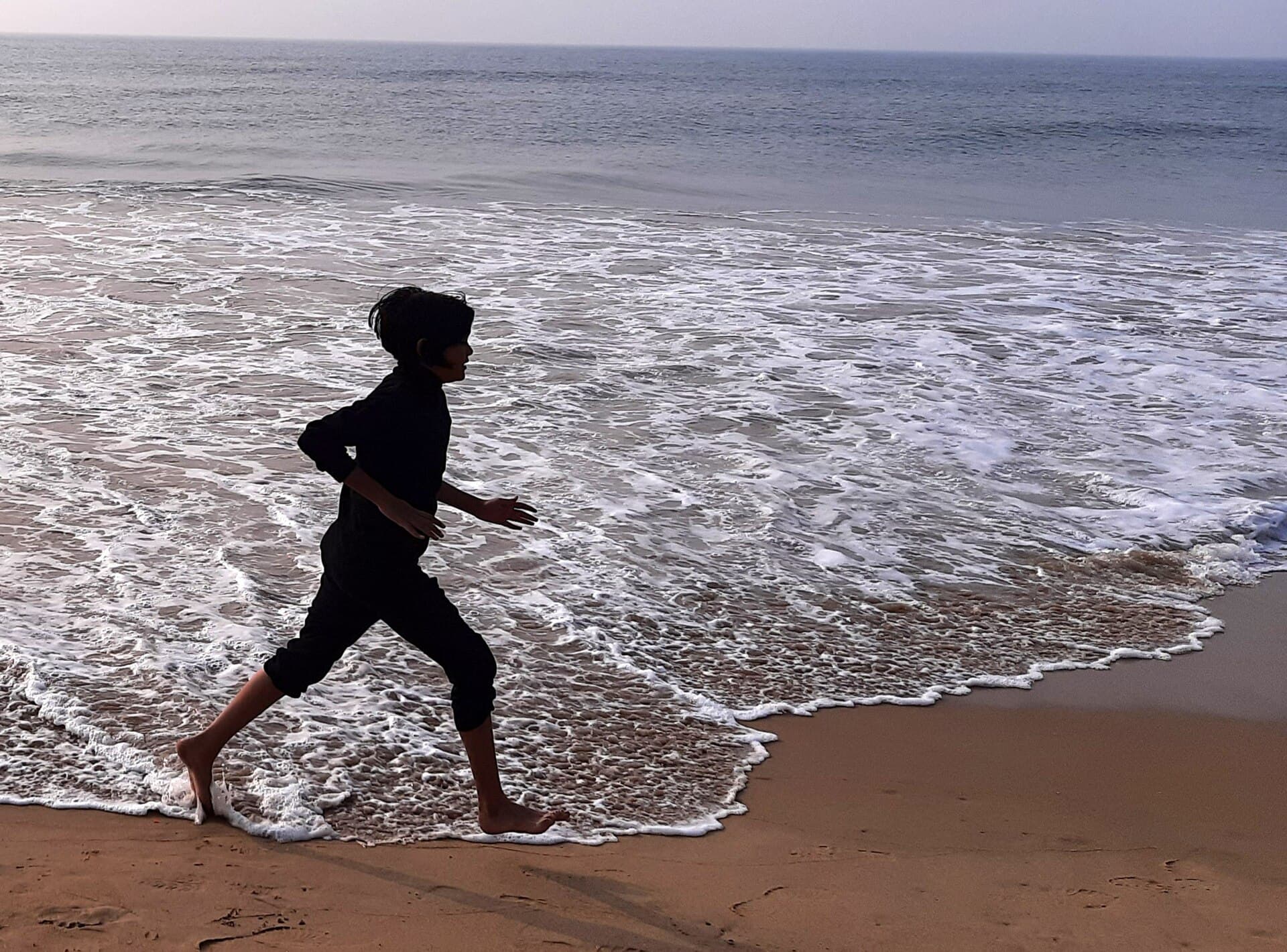 A runner moving at pace on an outdoor path
