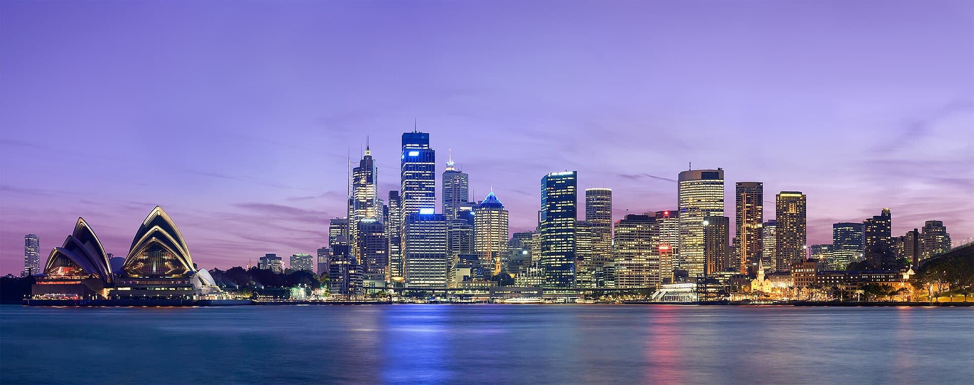 Sydney skyline at dusk across the harbour